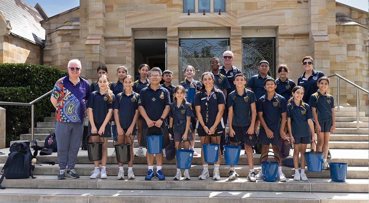 Jack De Groot, Bishop Vincent Long OFM Conv, and students from St Patrick's Primary Parramatta.