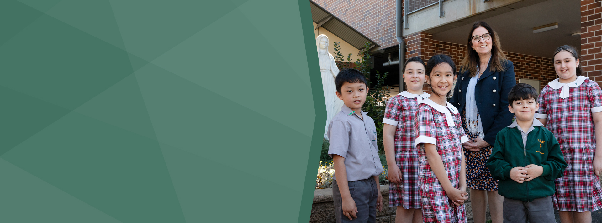 St Patrick's Catholic Primary Parramatta students standing with dedicated principal Mrs Bernadette Fabri