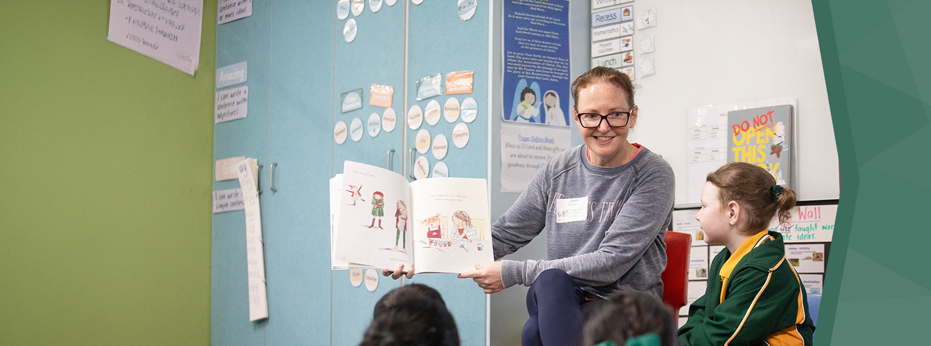St Patrick's Catholic Primary School Parramatta student reading with parent