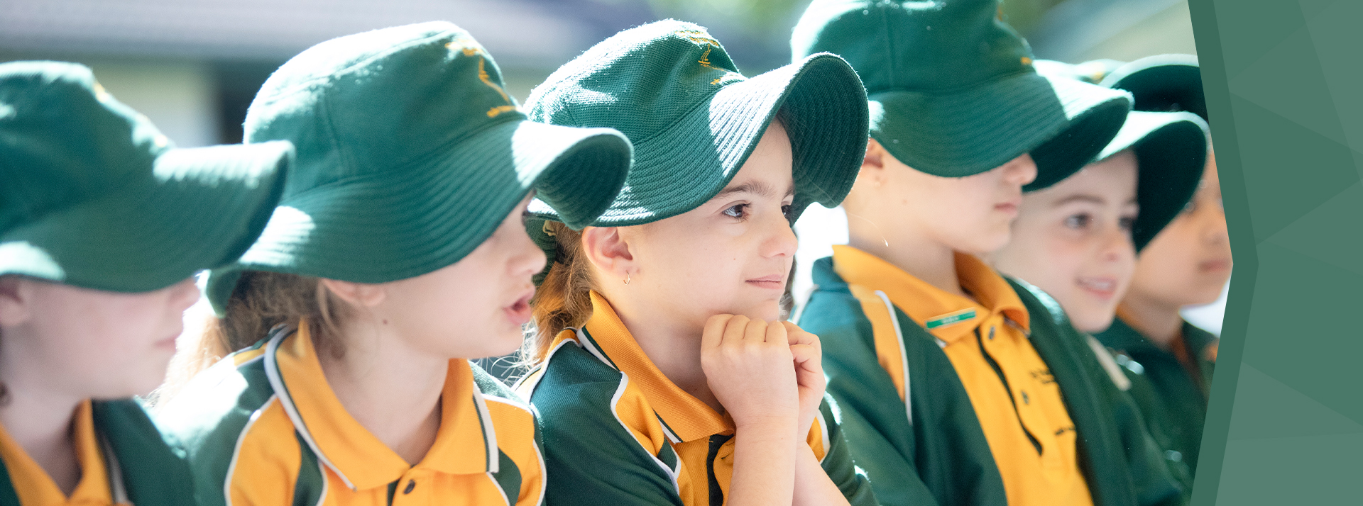 St Patrick's Catholic Primary Parramatta students smiling and sitting in a row
