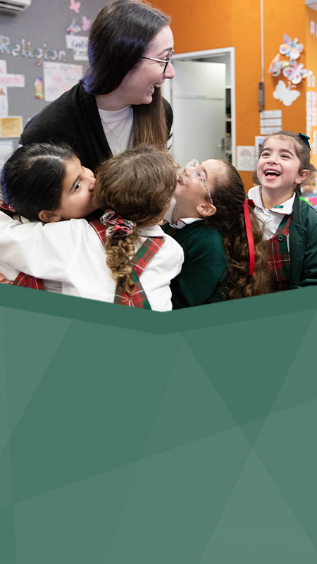 St Patrick's Catholic Primary School Parramatta students smiling with dedicated teacher