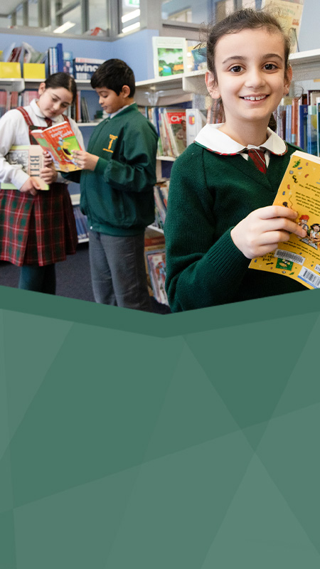 St Patrick's Catholic Primary Parramatta students inside the library reading books