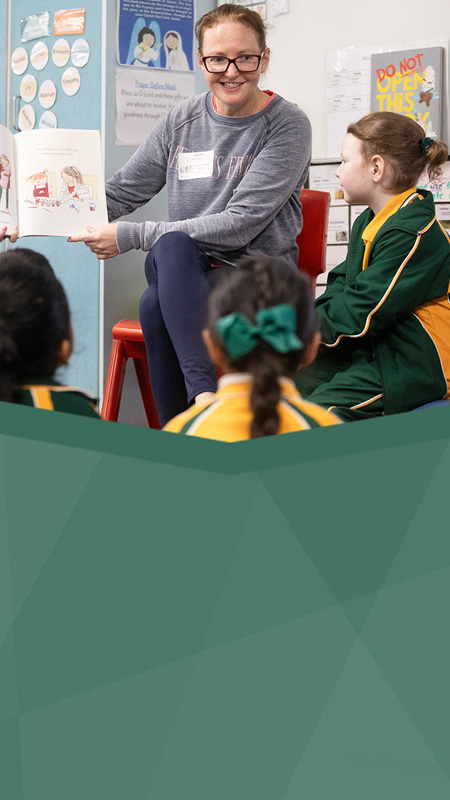 St Patrick's Catholic Primary School Parramatta student reading with parent