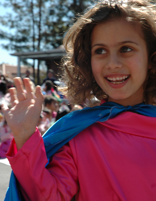 historical photo of St Patrick's Catholic Primary School Parramatta student waving in a parade