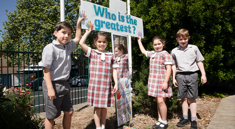 St Patrick's Catholic Primary School Parramatta students standing in front of recontextualised cross