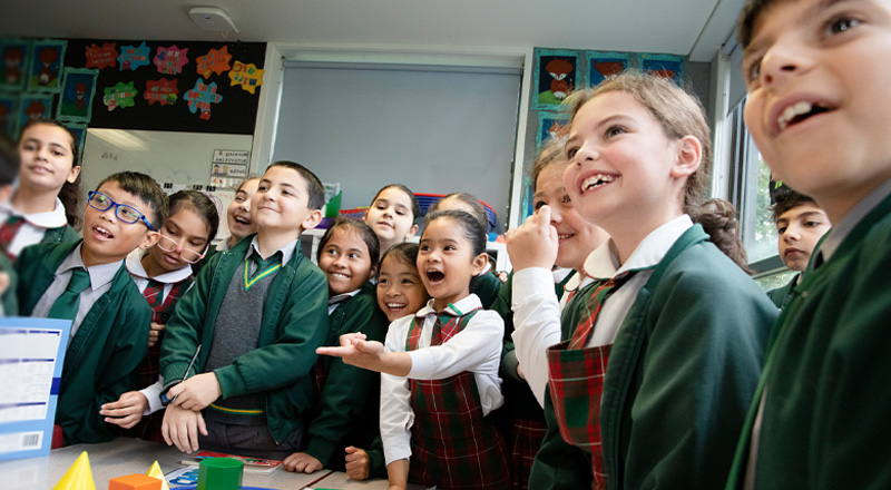 St Patrick's Catholic Primary School Parramatta students laughing in a classroom