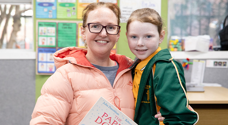 St Patrick's Catholic Primary School Parramatta parent sits supportively with child