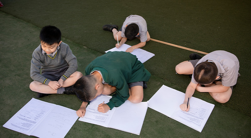 St Patrick's Catholic Primary School Parramatta students learning on ground