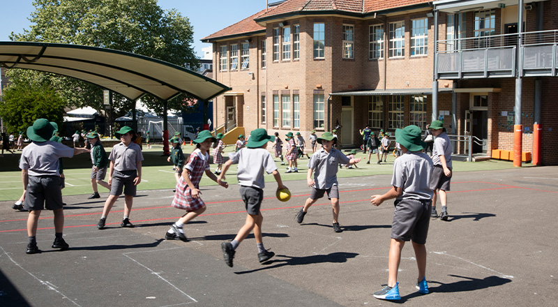 St Patrick's Catholic Primary School Parramatta students running on playground