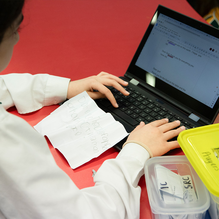 St Patrick's Catholic Primary School Parramatta student working on a laptop